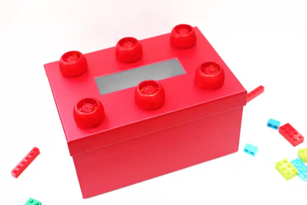 DIY LEGO Valentine Box - Cultivating Brilliant Minds a red box decorated to look like a lego for valentines