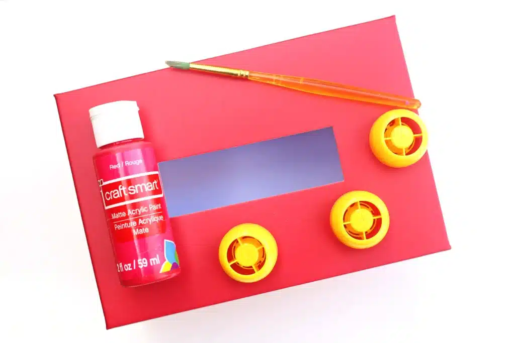 DIY LEGO Valentine Box - Cultivating Brilliant Minds red valentine box, red paint, paintbrush, and applesauce lids