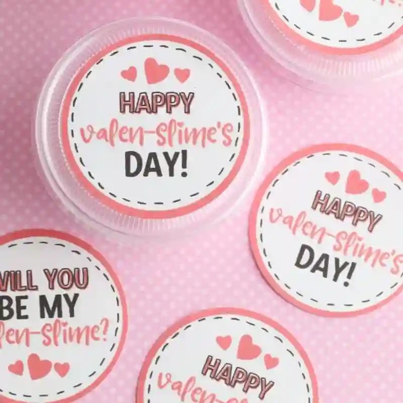 DIY Slime Valentine Cards - Cultivating Brilliant Minds slime valentine's day cards that read "happy valen-slime's day" attached to a container a slime