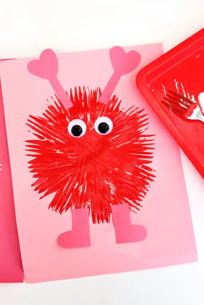 Fork Painted Love Monsters - Cultivating Brilliant Minds love monsters painted with a fork on construction paper