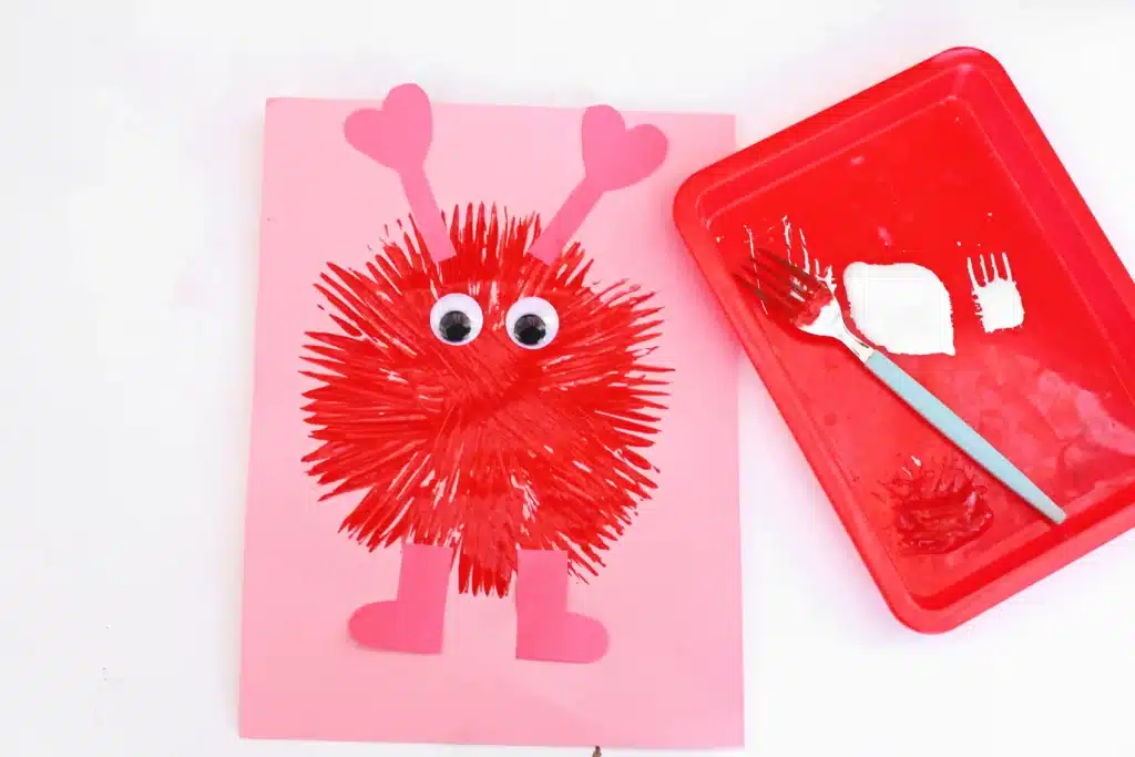 Fork Painted Love Monsters - Cultivating Brilliant Minds love monsters painted with a fork on construction paper