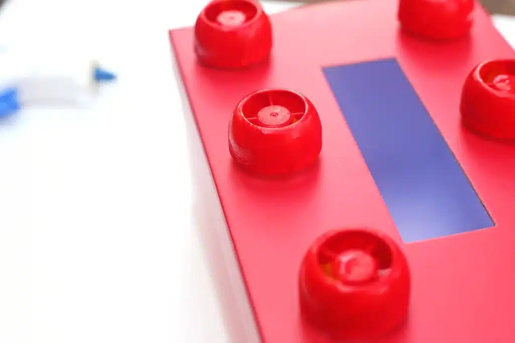 DIY LEGO Valentine Box - Cultivating Brilliant Minds a red box decorated to look like a lego for valentines