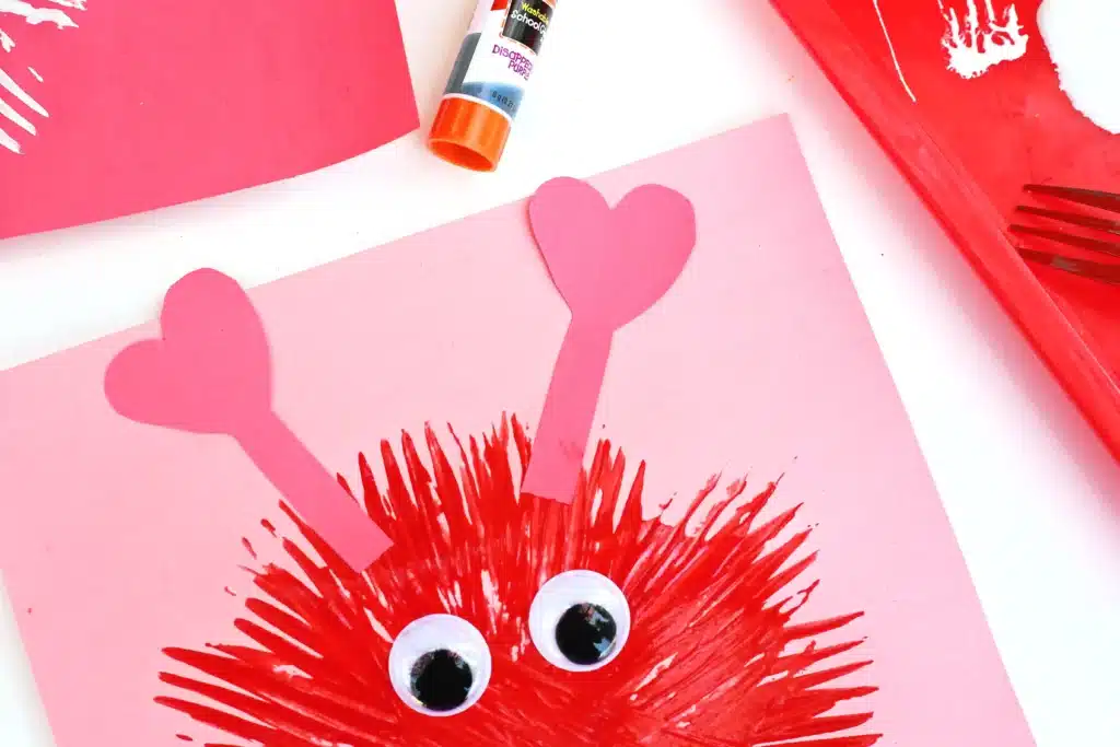 Fork Painted Love Monsters - Cultivating Brilliant Minds love monsters painted with a fork on construction paper