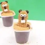Groundhog Pudding Cups - Cultivating Brilliant Minds pudding cups with nutter butters decorated to look like groundhogs