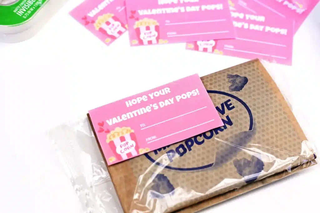 Printable Valentines - Cultivating Brilliant Minds printable valentine that reads "I hope you valentine's day pops!" attached to a bag of microwave popcorn.