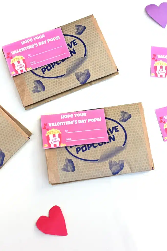 Printable Valentines - Cultivating Brilliant Minds printable valentine that reads "I hope you valentine's day pops!" attached to a bag of microwave popcorn.
