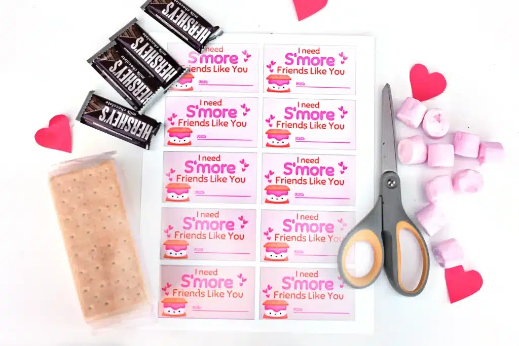 Printable Valentines I need s'more friends like you - Cultivating Brilliant Minds chocolate bars, graham crackers, marshmallows, scissors, and the printable "I need s'more friends like you" valentine