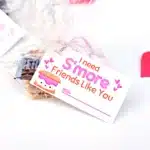 Printable Valentines I need s'more friends like you - Cultivating Brilliant Minds a bag filled with graham crackers, chocolate, and a marshmallow with a tag that reads "I need s'more friends like you"