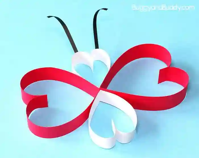 Heart-Themed Crafts For Kids This Valentine's Day - Cultivating Brilliant Minds a butterfly made out of construction paper. Each part of its' body are folded heart-shaped construction paper