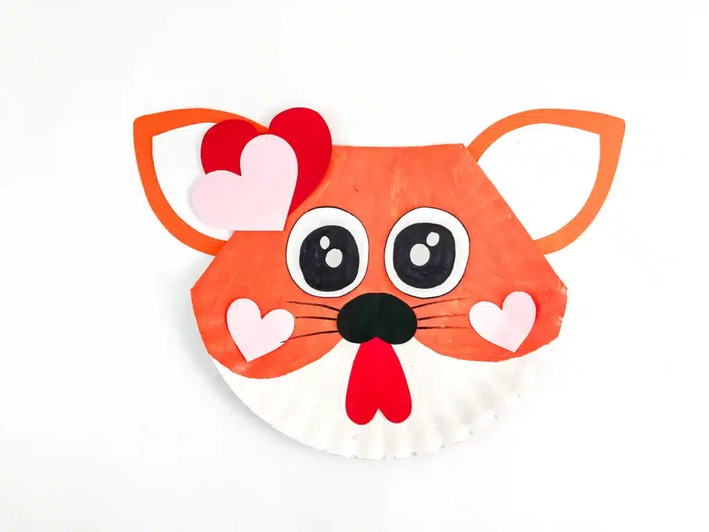 Valentine's Day Cat Craft - Cultivating Brilliant Minds a paper plate painted and decorated to look like a cat for valentine's day
