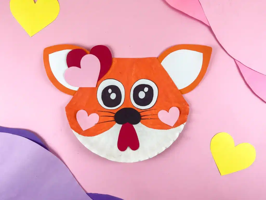 Valentine's Day Cat Craft - Cultivating Brilliant Minds a paper plate painted and decorated to look like a cat for valentine's day
