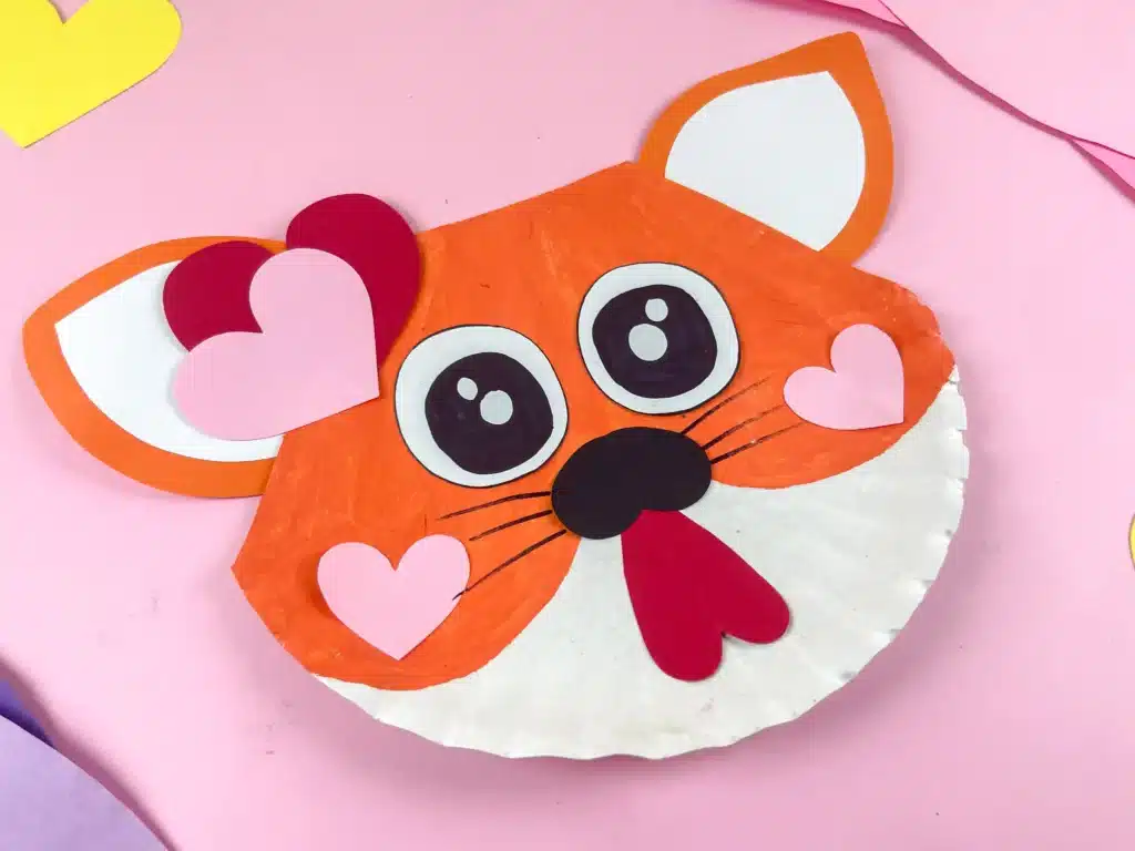 Valentine's Day Cat Craft - Cultivating Brilliant Minds a paper plate painted and decorated to look like a cat for valentine's day