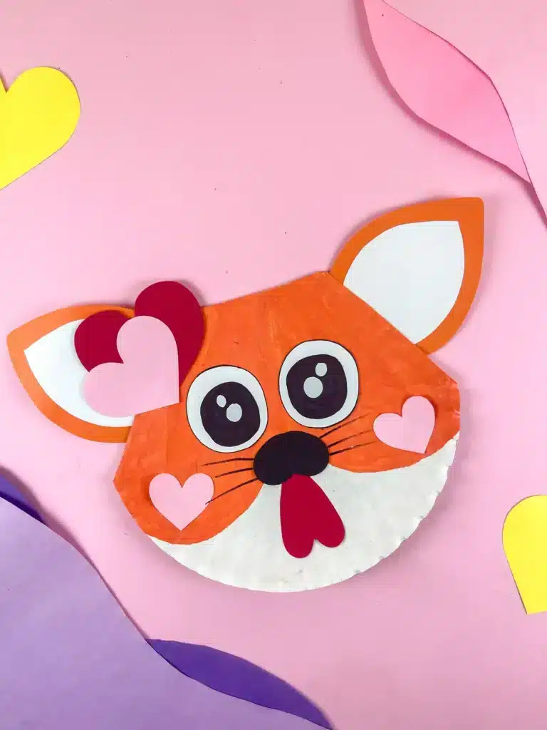 Valentine's Day Cat Craft - Cultivating Brilliant Minds a paper plate painted and decorated to look like a cat for a valentine's day cat craft