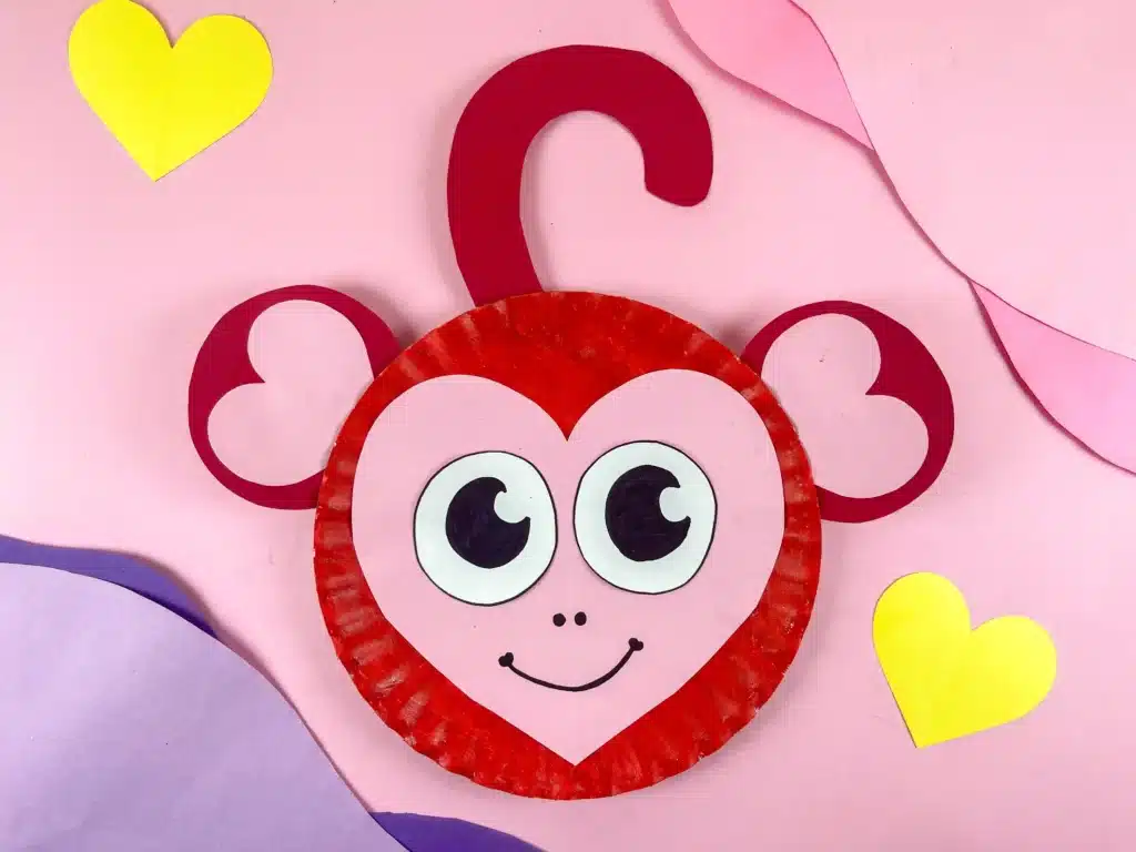 Valentine Monkey Craft - Cultivating Brilliant Minds A paper plate decorated to look like a red and pink monkey for valentine's day