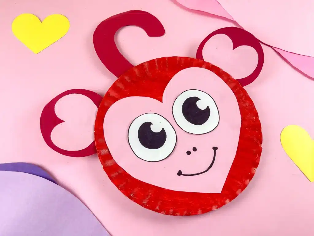 Valentine Monkey Craft - Cultivating Brilliant Minds A paper plate decorated to look like a red and pink monkey for valentine's day