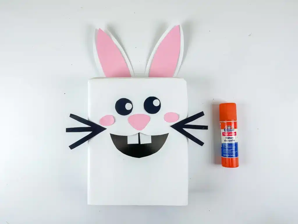 Bunny Valentines Box - Cultivating Brilliant Minds a bunny valentines box that has a box covered in white paper and a construction paper face, ears, and feet to look like a bunny