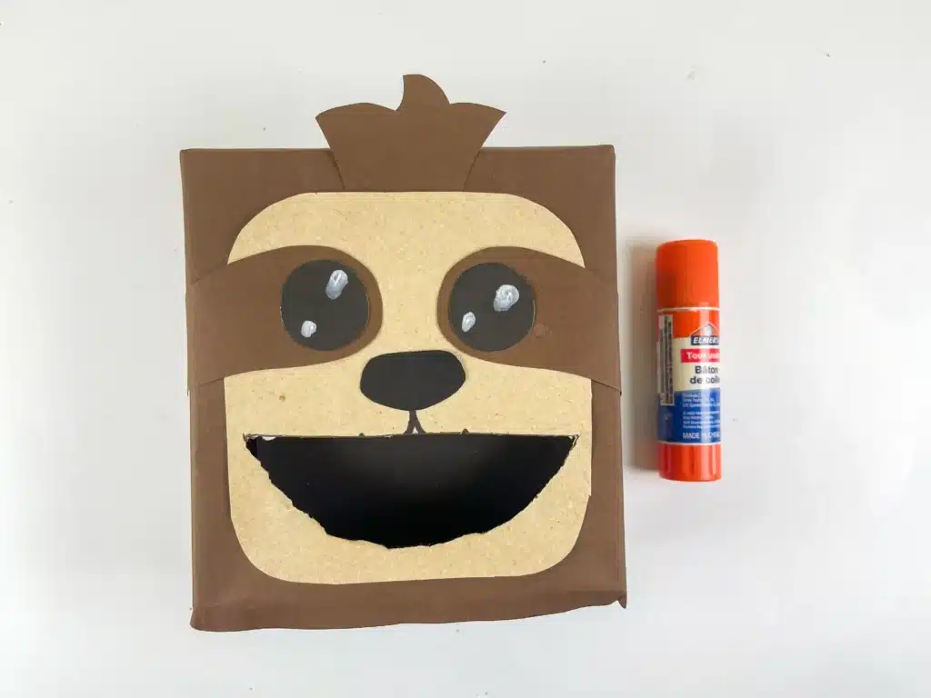 Sloth Valentine Box - Cultivating Brilliant Minds a sloth valentine box covered in brown paper and construction paper to look like a sloth