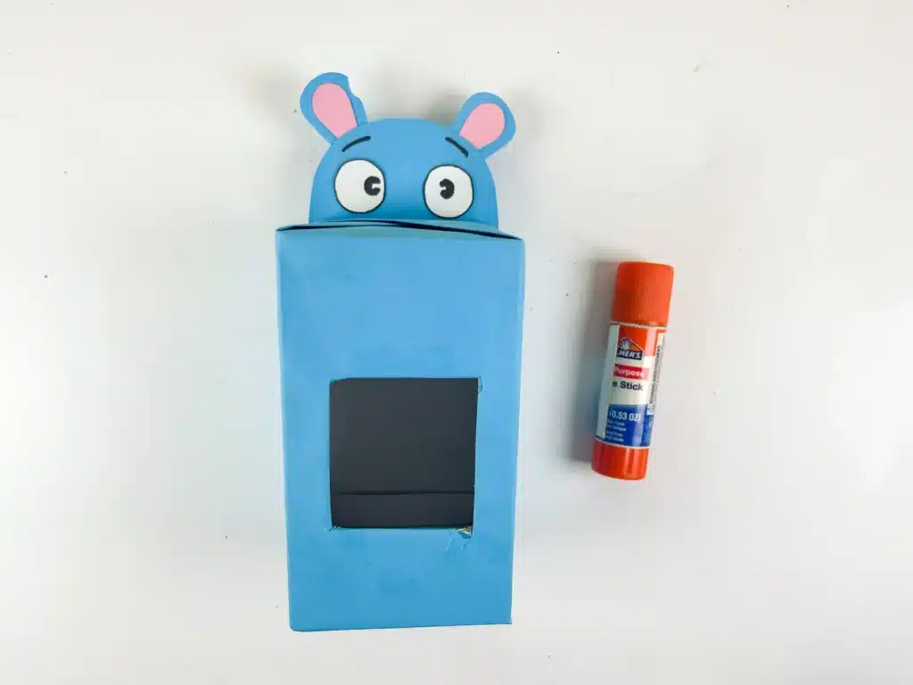 Hippo Valentine Box - Cultivating Brilliant Minds a box covered in blue paper with a hippo face made out of construction paper attached