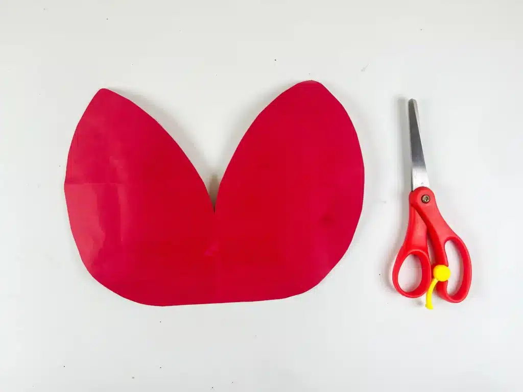 DIY Ladybug Valentine Box - Cultivating Brilliant Minds red paper cut to look like ladybug wings