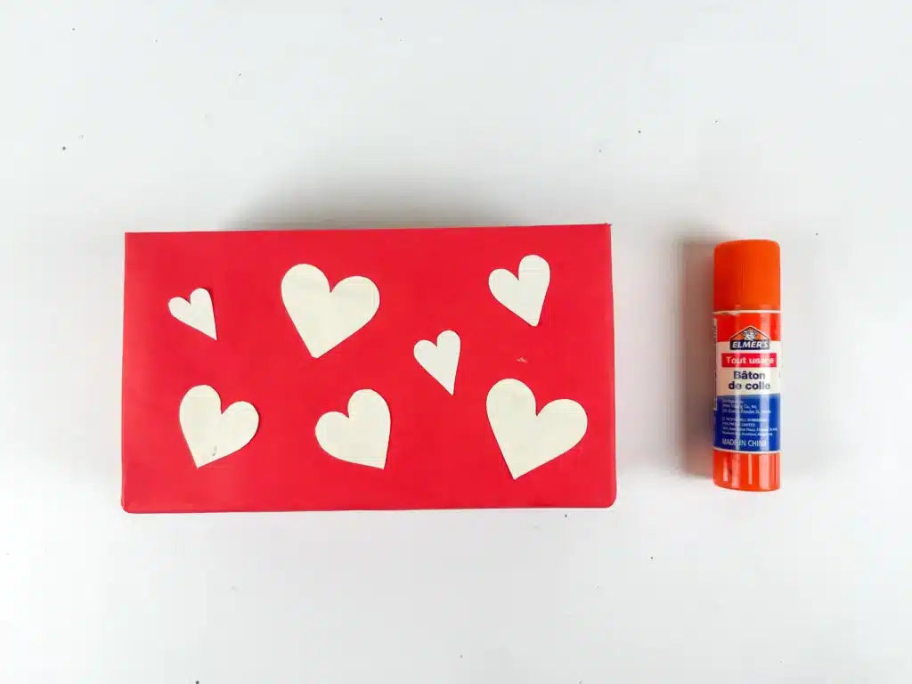 Love Bear Valentine Box - Cultivating Brilliant Minds a box covered in red paper and white hearts