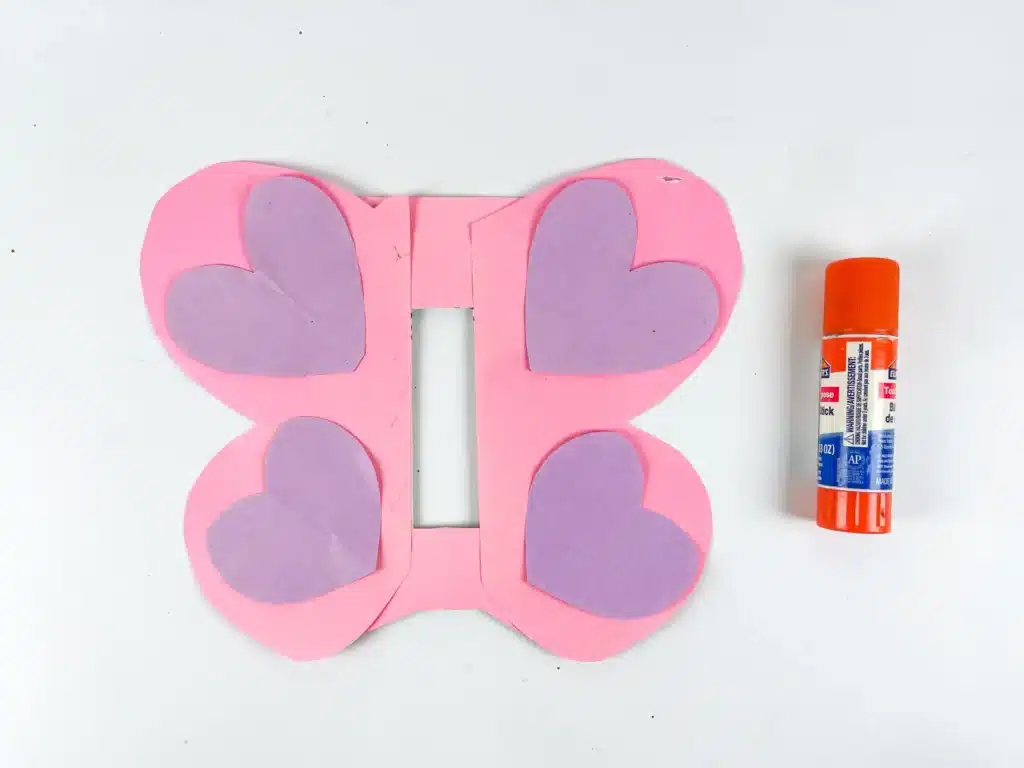 Butterfly Valentines Box - Cultivating Brilliant Minds butterfly wings cut out of pink paper with purple hearts glued on