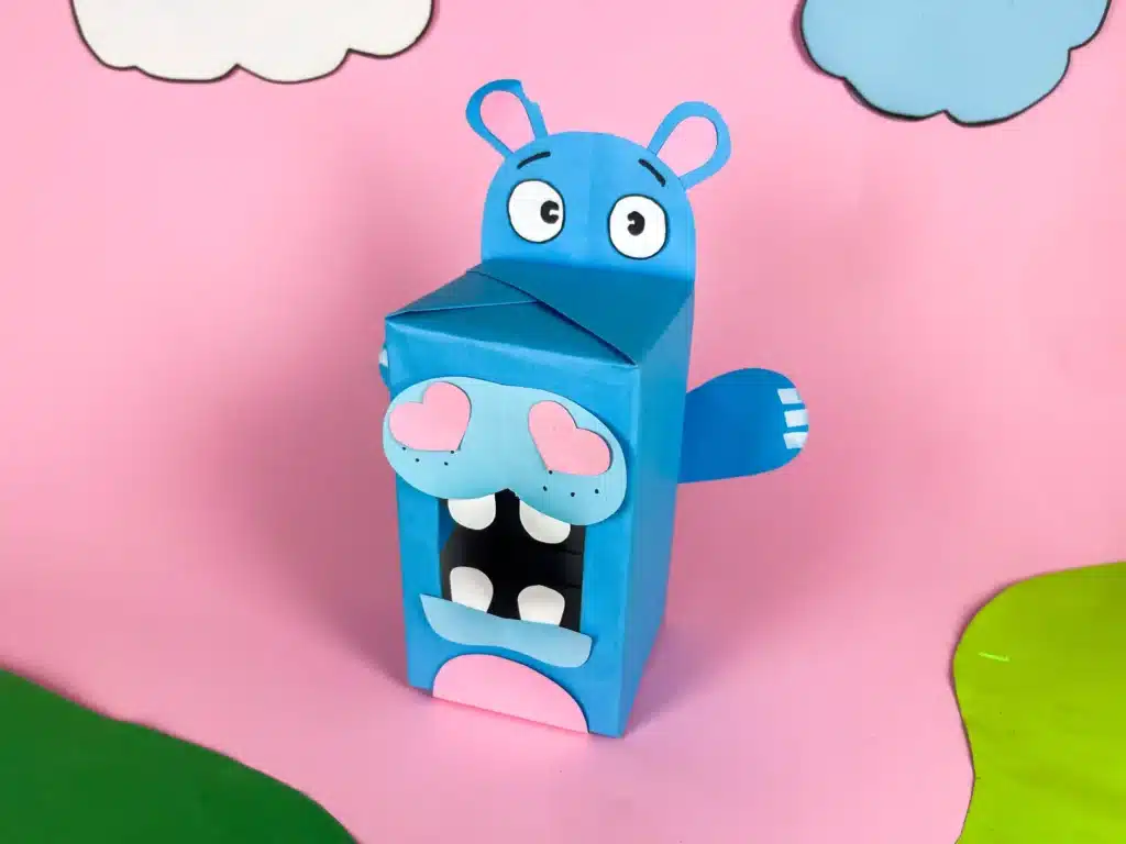 Hippo Valentine Box - Cultivating Brilliant Minds a hippo valentine box that is a box covered in blue paper with a construction paper face, snout. arms, and teeth