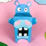 Hippo Valentine Box - Cultivating Brilliant Minds a hippo valentine box that is a box covered in blue paper with a construction paper face, snout. arms, and teeth