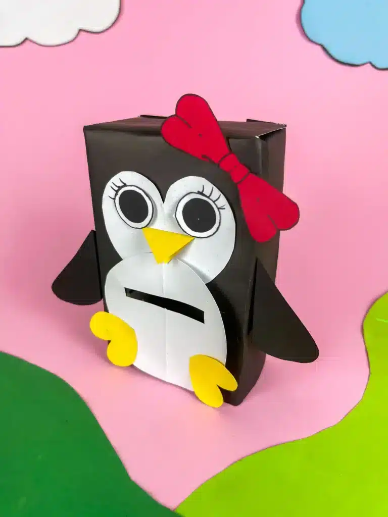 Penguin Valentine Box - Cultivating Brilliant Minds penguin valentines box - a box covered in black paper with a slide for valentines and decorated to look like a penguin