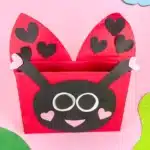 DIY Ladybug Valentine Box - Cultivating Brilliant Minds a diy valentine box that is covered in red paper and decorated with construction paper to look like a ladybug