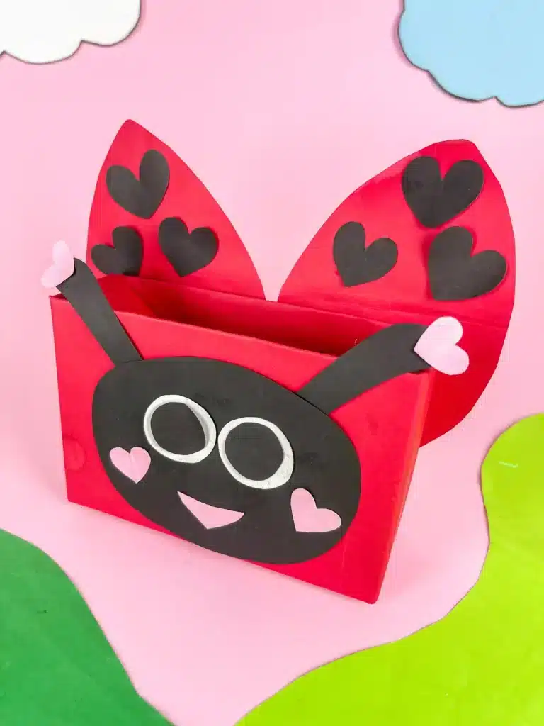 DIY Ladybug Valentine Box - Cultivating Brilliant Minds a diy valentine box that is covered in red paper and decorated with construction paper to look like a ladybug