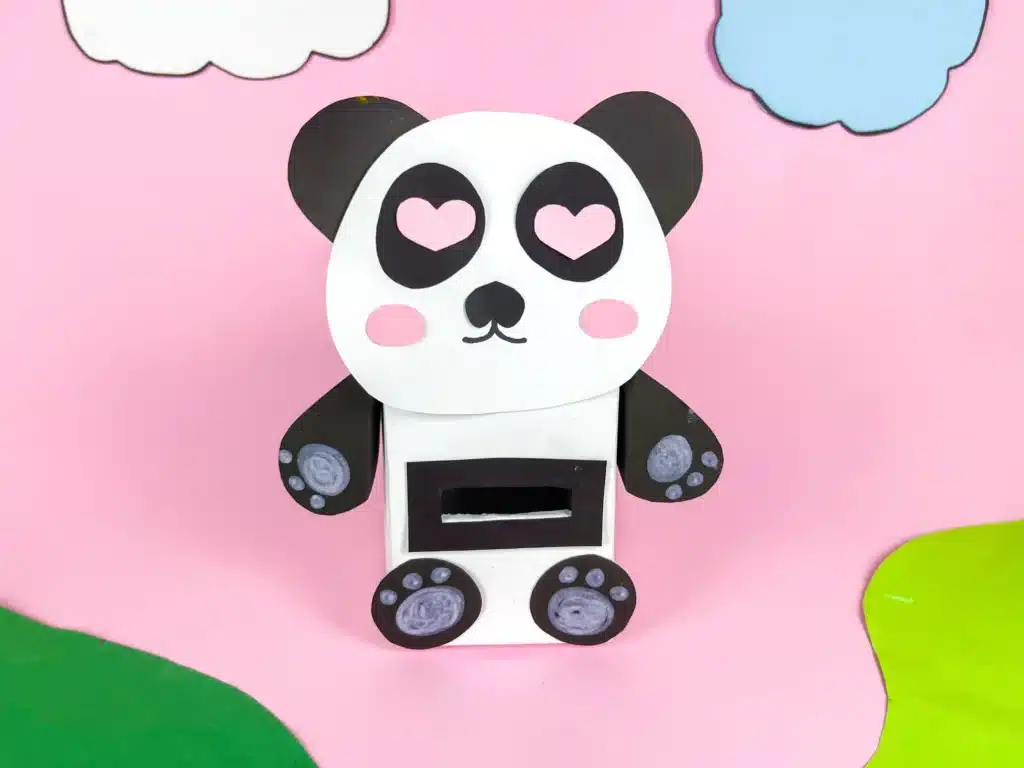 Panda Valentines Box - Cultivating Brilliant Minds a panda valentines box that has a box wrapped in white paper and a construction paper panda face, arms, and legs attached