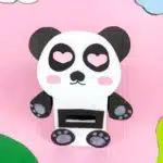 Panda Valentines Box - Cultivating Brilliant Minds a panda valentines box that has a box wrapped in white paper and a construction paper panda face, arms, and legs attached