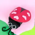 Ladybug Valentines Box - Cultivating Brilliant Minds a ladybug valentines box that has a box covered in black paper with a construction paper ladybug head and construction paper wings with hearts