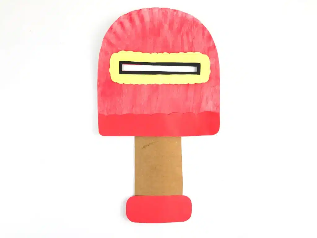 Valentine's Day Mailbox Paper Plate Craft - Cultivating Brilliant Minds a paper plate painted pink and cut into the shape of a mailbox with a slot cut in the middle for mail.