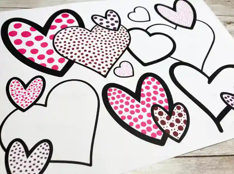 Heart-Themed Crafts For Kids This Valentine's Day - Cultivating Brilliant Minds a piece of paper with a bunch of different hearts printed on it. In each heart there are dots of paint to make it look like pointillism.