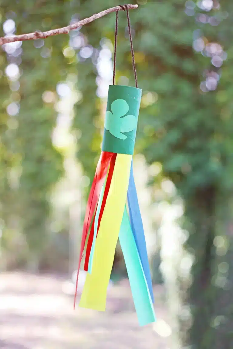 St. Patrick's Day Rainbow Toilet Paper Roll Streamer - a toilet paper roll painted green attached to different colored streamers