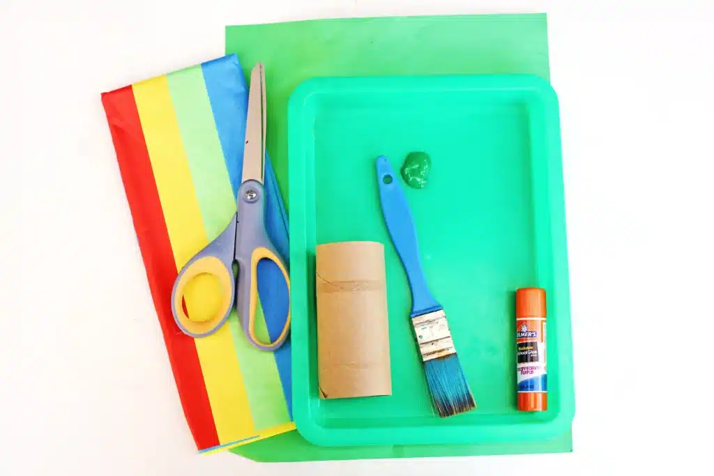 St. Patrick's Day Rainbow Toilet Paper Roll Streamer - Cultivating Brilliant Minds colored tissue paper, green construction paper, scissors, glue, green paint, a paintbrush, and a toilet paper roll