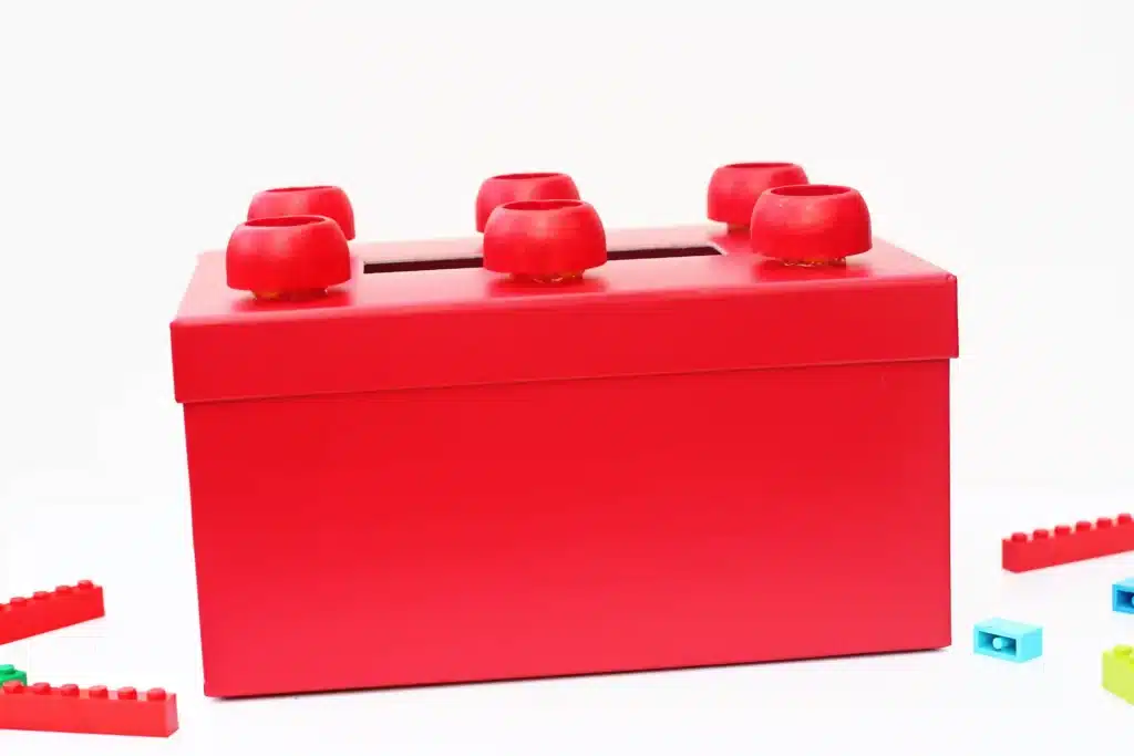 DIY LEGO Valentine Box - Cultivating Brilliant Minds a red box decorated to look like a lego for valentines