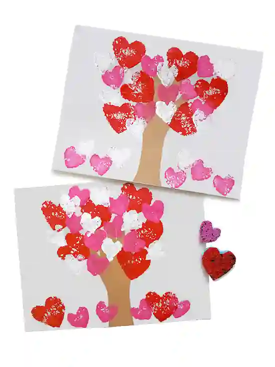 Heart-Themed Crafts For Kids This Valentine's Day - Cultivating Brilliant Minds a tree with heart-shaped leaves made by using a sponge.