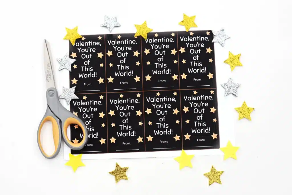 Printable Valentine You're Out of This World - Cultivating Brilliant Minds a printable valentine that reads "valentine, you're out of this world" next to foam stars and scissors