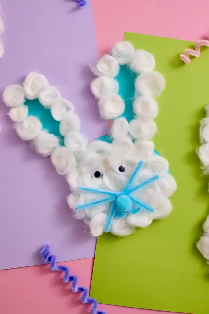 Cotton Ball Bunny Craft - Cultivating Brilliant Minds a cotton ball bunny craft that has cotton balls glued on a bunny cut out of construction paper