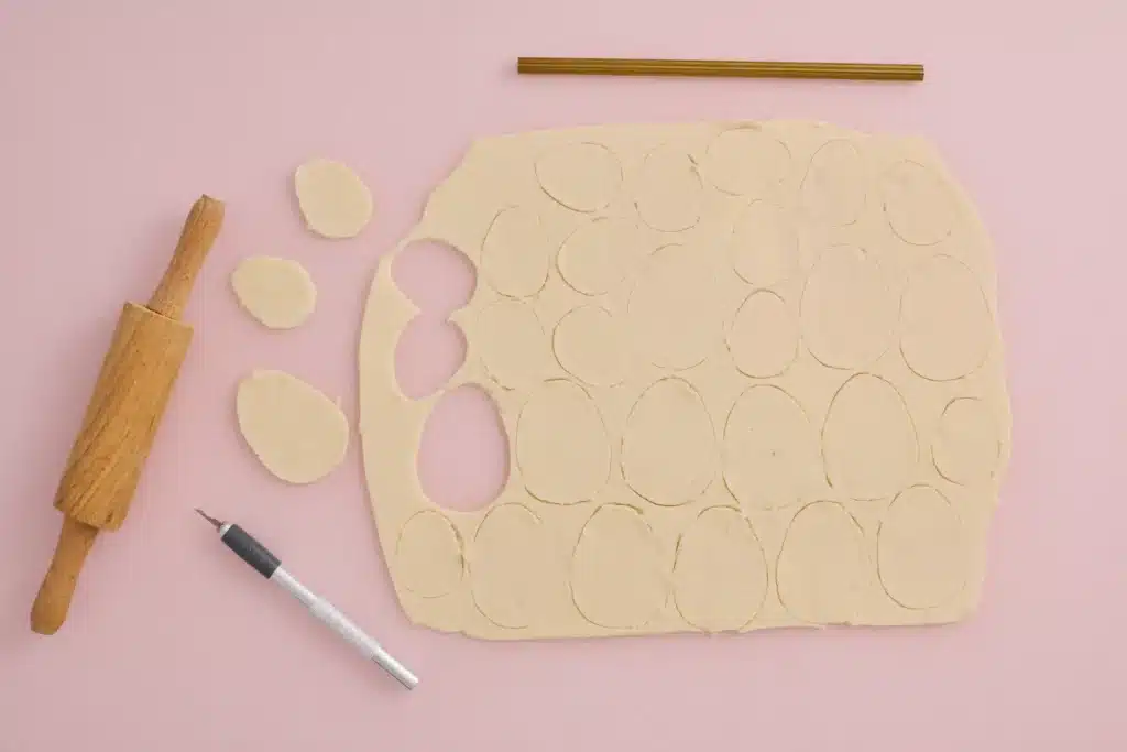 Easter Egg Salt Dough Ornaments For Kids - Cultivating Brilliant Minds salt dough rolled out flat with ovals cut out of it