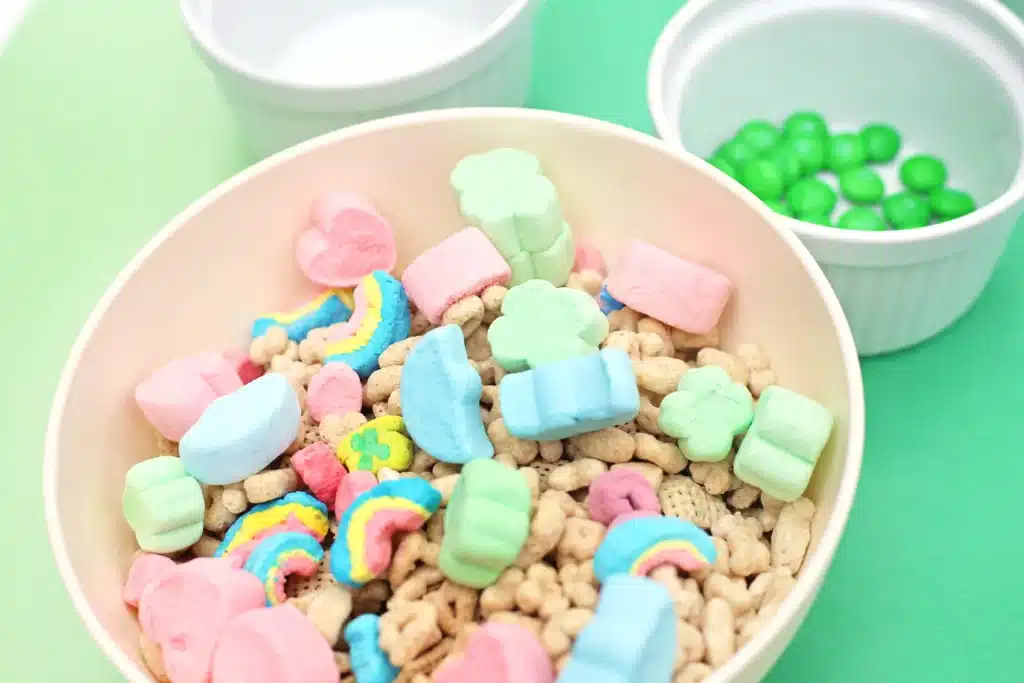 Leprechaun Bait Snack Mix - Cultivating Brilliant Minds chex mix, lucky charms, and big lucky charm marshmallows in a bowl