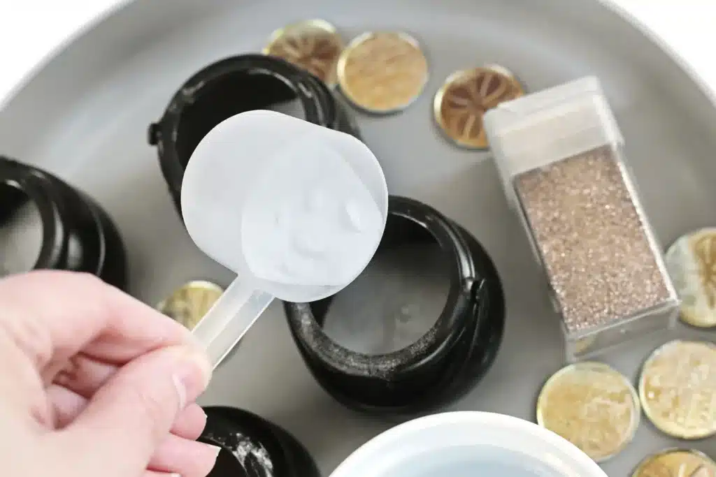 Fizzy Pot of Gold Experiment - Cultivating Brilliant Minds a black cauldron pot with baking soda inside