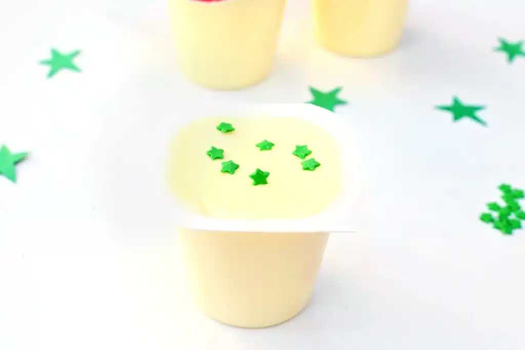 Sneetches Pudding Cups - Cultivating Brilliant Minds vanilla pudding cups with green star sprinkles inside