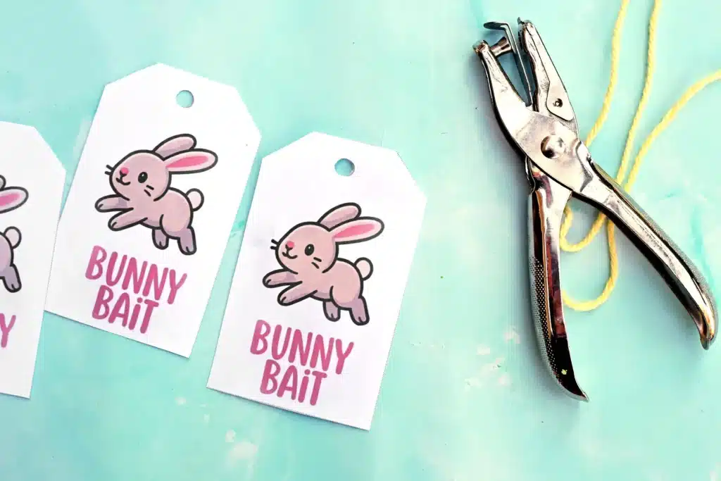 Bunny Bait Printable for Easter - Cultivating Brilliant Minds a tag that reads "bunny bait" next to a hole puncher