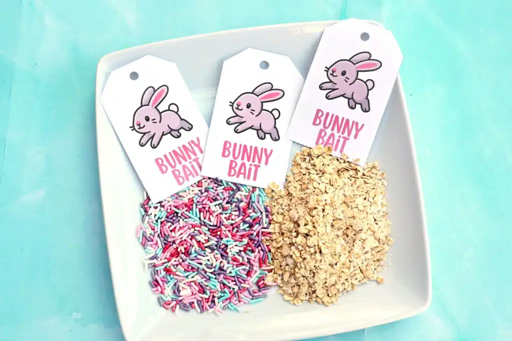Bunny Bait Printable for Easter - Cultivating Brilliant Minds sprinkles and oats on a plate with tags that read "bunny bait"