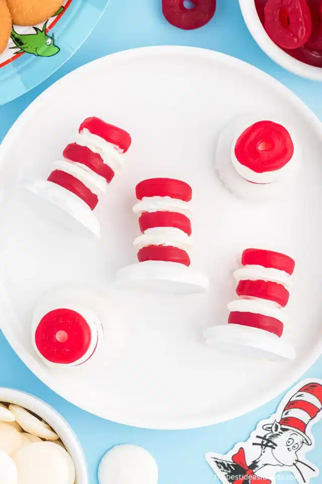 Dr. Seuss Inspired Treats - Cultivating Brilliant Minds red life savers and white candy melts stacked together to create the cat in the hat's hat