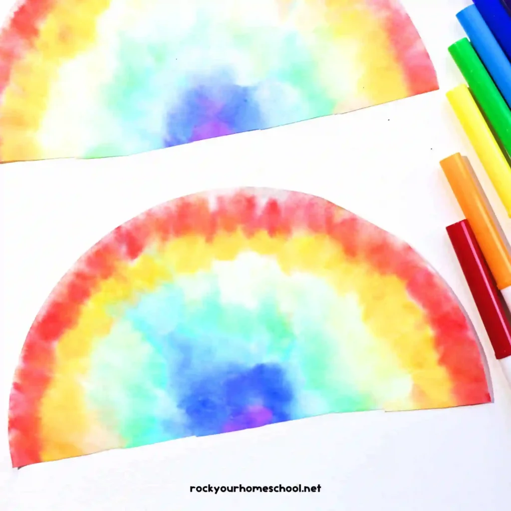 Easy Rainbow Art Projects for St. Patrick's Day - Cultivating Brilliant Minds a rainbow painted on a coffee filer