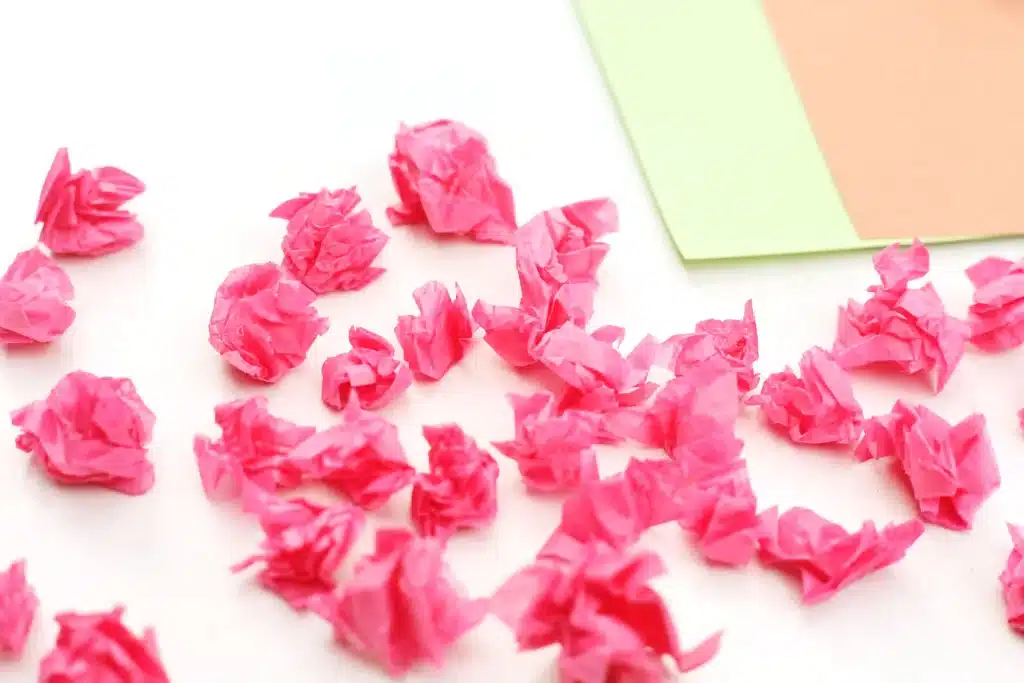 Handprint Cherry Blossom Tree - Cultivating Brilliant Minds crumbled strips of pink tissue paper